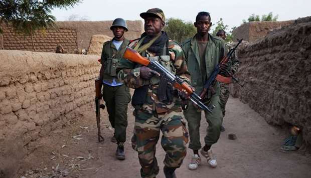 Malian soldiers patrol in the village of Kadji. File photo: March 1, 2013