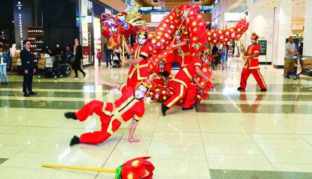 Dragon Parade performers entertain Doha Festival City shoppers on Saturday.