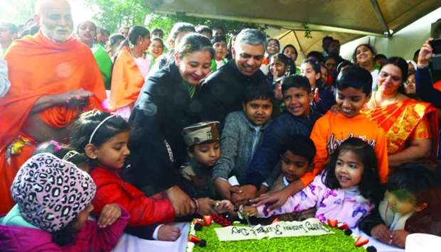 Indian ambassador P Kumaran along with students and community members cutting a cake to mark the 71st Republic Day. PICTURES: Jayan Orma.