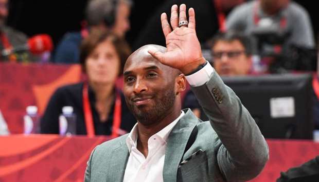 Kobe Bryant waves at the crowd during the Basketball World Cup semi-final game between Australia and Spain in Beijing. File picture:  September 13, 2019. AFP