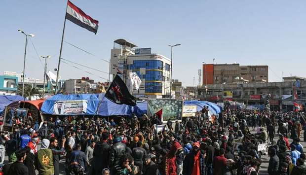 Anti-government protesters gather during a demonstration in the city of Nasiriyah in Iraq's southern Dhi Qar province.