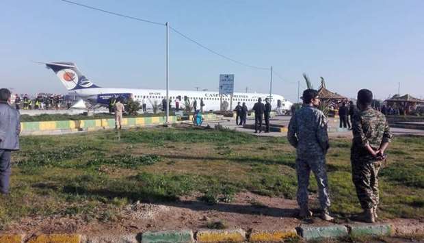 Iranian passenger plane is seen after sliding off the runway upon landing at Mahshahr airport