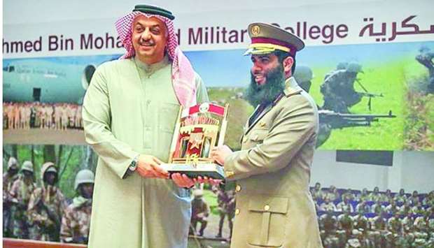 HE Dr Khalid bin Mohamed al-Attiyah receiving a memento.