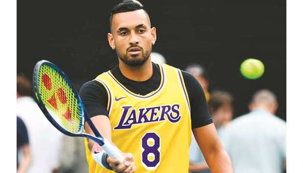 Australiau2019s Nick Kyrgios wearing a Los Angeles Lakers jersey with former basketball player Kobe Bryantu2019s number during his warm-up before the match against Spainu2019s Rafael Nadal in Melbourne. (AFP)