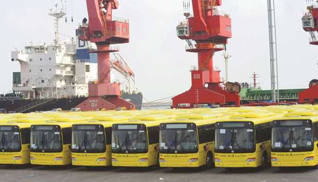 Buses wait to be exported in Lianyungang port. Chinau2019s GDP growth slumped to near 30-year lows in 2019, pressured by sluggish domestic demand and trade frictions with the US.