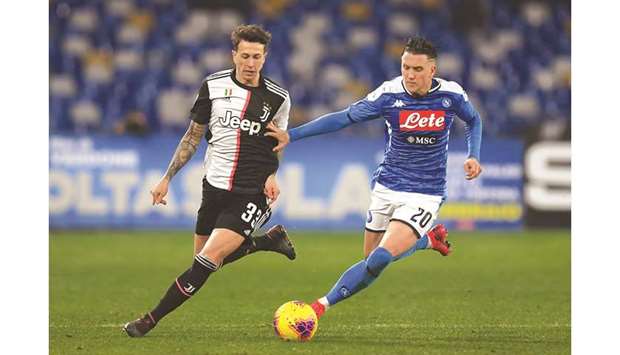 Napoliu2019s Piotr Zielinski (right) and Juventusu2019 Federico Bernardeschi in action during their Serie A game in Naples, Italy. (Reuters)