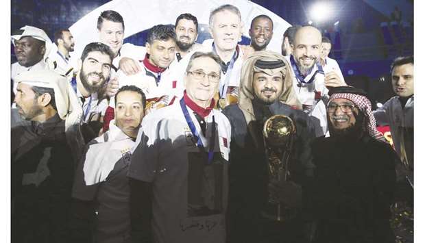 HE Sheikh Joaan bin Hamad al-Thani, the president of the Qatar Olympic Committee, poses with coach Valero Rivera, Qatar Handball Association president Ahmed al-Shabi and members of the team and support staff after Qatar won the Asian Handball Championship yesterday.