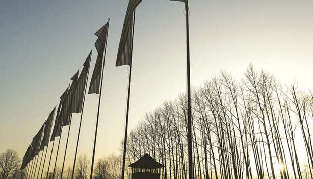 The sun sets over the former Nazi German concentration and extermination camp Auschwitz II-Birkenau, during ceremonies marking the 75th anniversary of the liberation of the camp and International Holocaust Victims Remembrance Day, in Brzezinka, near Oswiecim, Poland.
