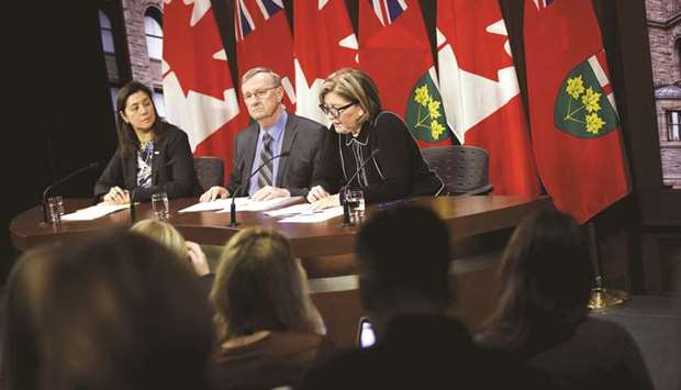 Dr Barbara Yaffe, Ontariou2019s Associate Chief Medical Officer of Health (right) speaks as Ontario Chief Medical Officer Dr David Williams and Dr Eileen de Villa, Medical Officer of Health for the City of Toronto, listen on, during a press briefing on the coronavirus at Queens Park in Toronto yesterday.