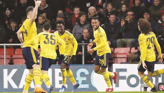 Arsenalu2019s Bukayo Saka (third left) celebrates after scoring in the FA Cup fourth round match against Bournemouth. (Reuters)