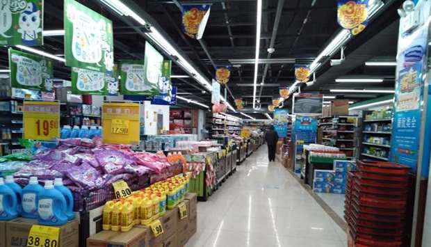 A customer walks in a supermarket in Wuhan, Hubei province, China. INSTAGRAM/EMILIA via REUTERS