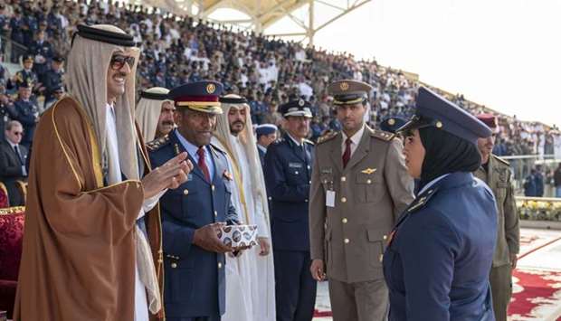 His Highness the Amir Sheikh Tamim bin Hamad al-Thani honours the first Qatari female fighter pilot after she graduated from Al Zaeem Mohamed Bin Abdullah Al Attiyah Air College.