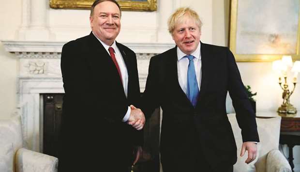 Prime Minister Boris Johnson greets US Secretary of State Mike Pompeo on his arrival to hold talks at 10 Downing Street in London yesterday.