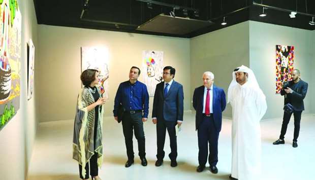 Artist Nameer Qassem explains about the exhibition to Katara general manager Dr Khalid bin Ibrahim al-Sulaiti, Palestinian ambassador Munir Ghannam and other dignitaries.