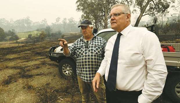 Australiau2019s Prime Minister Scott Morrison visits a wildflower farm in an area devastated by bushfires in Sarsfield, Victoria state, yesterday.
