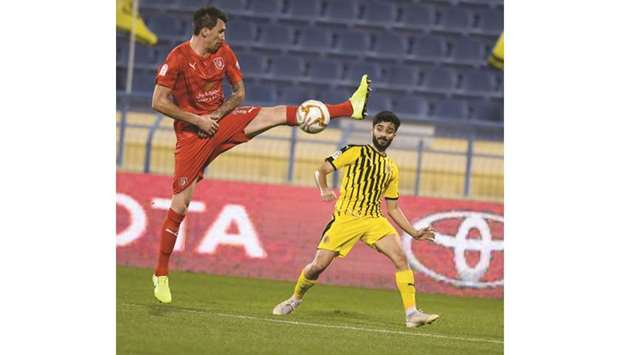 Al Duhailu2019s Mario Mandzukic (left) in action during the QNB Stars League match against Qatar SC yesterday. PICTURE: Shemeer Rasheed