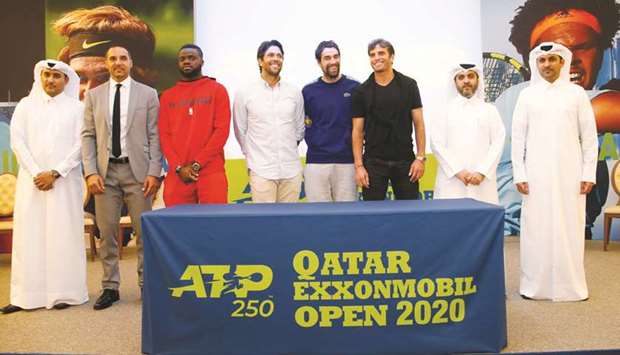 Tennis players Frances Tiafoe of the US (third left), Fernando Verdasco of Spain (fourth left), Jeremy Chardy of France (fifth left) and Makel Jaziri of Tunisia (sixth left) pose with tennis officials at the draw Saturday.