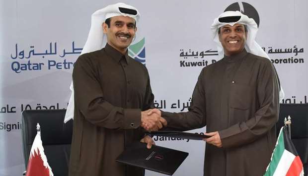 HE Saad Sherida Al-Kaabi, the Minister of State for Energy Affairs & the President and CEO of Qatar Petroleum and  Dr. Khaled A. Al-Fadhel, the Minister of Oil and the Minister of Electricity & Water, the Chairman of the Board of Kuwait Petroleum Corporation shake hands after signing the agreement.