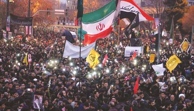 Iranians gather in the northeastern city of Mashhad yesterday to pay homage to top general Qasem Soleimani after he was killed in a US strike in Baghdad.