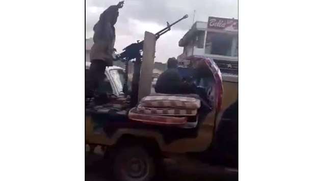 An image grab from a video posted on social media shows an armed vehicle entering Sirte