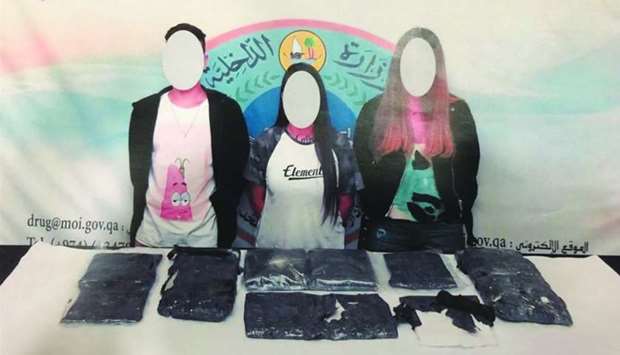 The three arrested persons with recovered packets of drug.