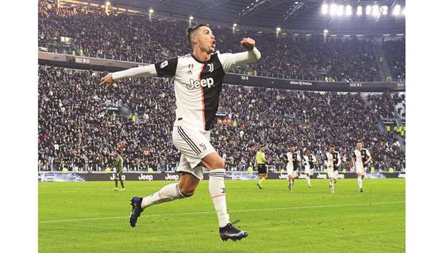 Juventusu2019 Cristiano Ronaldo celebrates scoring their second goal against Cagliari at the Allianz Stadium in Turin yesterday. (Reuters)