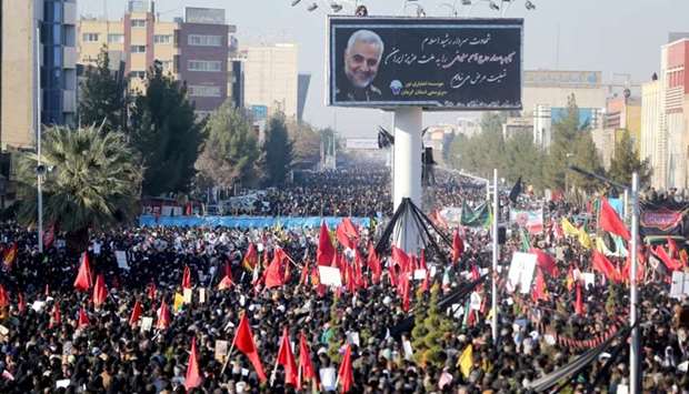 Iranian people attend a funeral procession and burial for Iranian Major-General Qassem Soleimani, head of the elite Quds Force, who was killed in an air strike at Baghdad airport, at his hometown in Kerman, Iran
