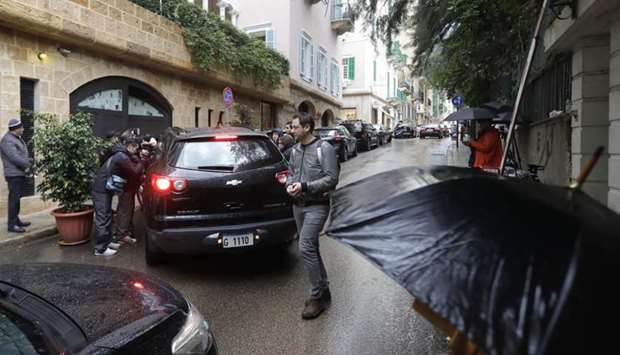 Reporters gather outside a house said to belong to former Nissan chief Carlos Ghosn in a wealthy neighbourhood of Lebanon's capital Beirut