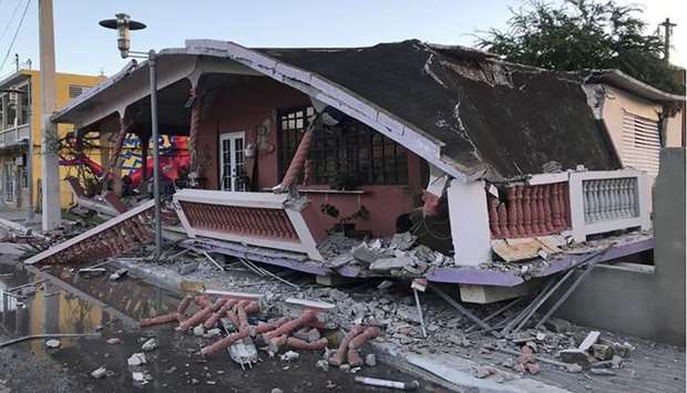 A home is seen collapsed after an earthquake in Guanica, Puerto Rico