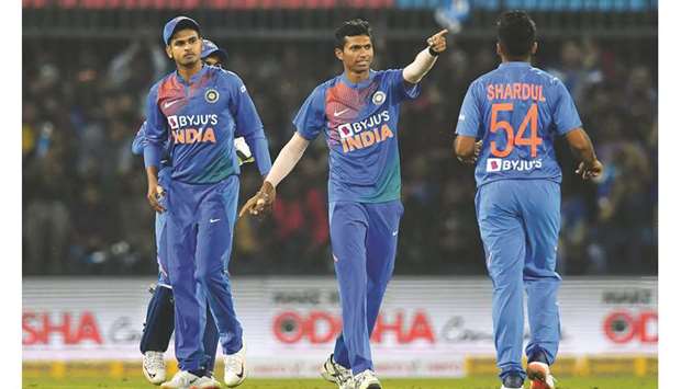 Indiau2019s Navdeep Saini (centre) celebrates after taking the wicket of Sri Lankau2019s Danushka Gunathilaka (not in the picture) during the second T20 in Indore yesterday. (AFP)