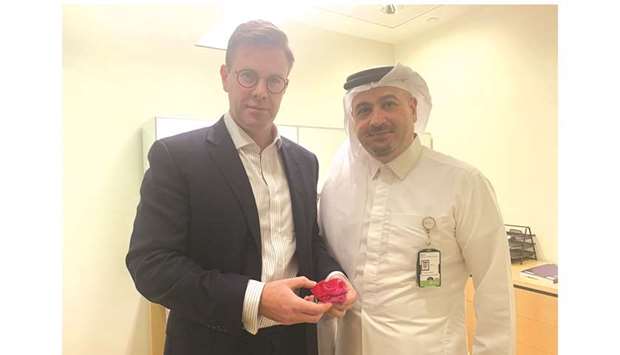 Dr Graeme Glass and Dr Faisal Abdelkader with the 3D model of the Micrognathia patientu2019s jaw.