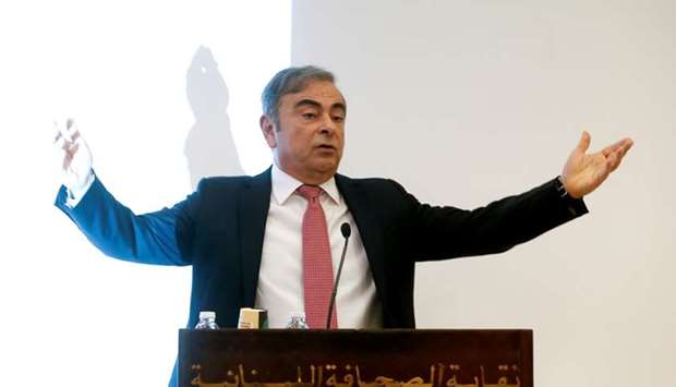 Former Nissan chairman Carlos Ghosn gestures as he speaks during a news conference at the Lebanese Press Syndicate in Beirut, Lebanon