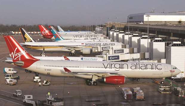 Aircraft sit parked at the gates of Terminal-2 at Manchester airport. Industry figures show as many as 204 airports globally require u201cslot co-ordinationu201d now because they have insufficient capacity to meet demand at all times of the day.
