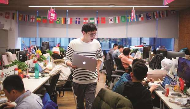 Employees work at AliExpress office at the Alibaba companyu2019s headquarters in Hangzhou, Zhejiang province. AliExpress has approached well-known brands including Mango, Benetton and Spanish fashion group Tendam, owner of Cortefiel, to appear on the site with limited success, sources said.