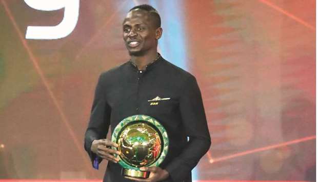 Senegal winger Sadio Mane smiles after winning the Player of the Year award during the 2019 CAF Awards in Egyptian resort town of Hurghada on Tuesday. (AFP)