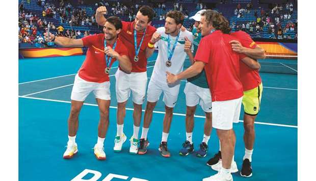Rafael Nadal (left) of Spain takes a team selfie after receiving their medals for qualifying for the Cup quarter-finals in Perth yesterday. (AFP)