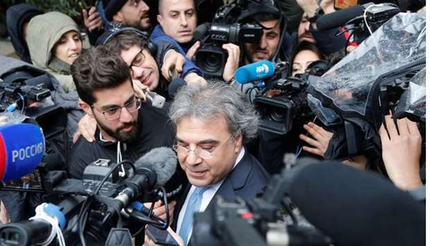 The lawyer of former Nissan chairman Carlos Ghosn speaks to the media after Ghosn's questioning, outside the Justice Palace in Beirut
