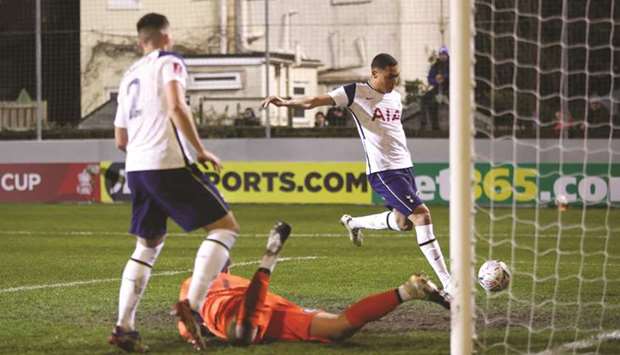Tottenham Hotspuru2019s Carlos Vinicius (right) scores their second goal during the FA Cup match against Marine AFC at Rossett Park in Crosby, United Kingdom, yesterday. (Reuters)