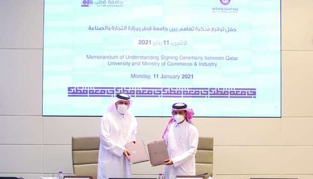 Dr Hassan Rashid al-Derham and Sultan bin Rashid al-Khater at the signing ceremony.