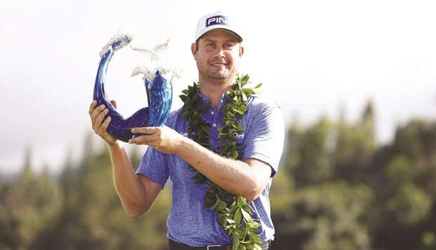 Harris English of the United States poses with the trophy after defeating Joaquin Niemann of Chile (not pictured) in a playoff during the final round of the Sentry Tournament of Champions at the Kapalua Plantation Course in Kapalua, Hawaii.  