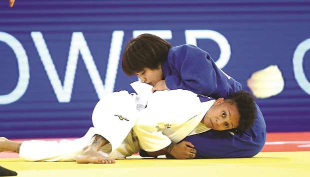 Amandine Buchard (in white) of France in action against Ai Shishime of Japan in the final of the under 52kg category during the IJF Doha Masters judo tournament at the Lusail Multipurpose Hall yesterday. PICTURES: Jayan Orma