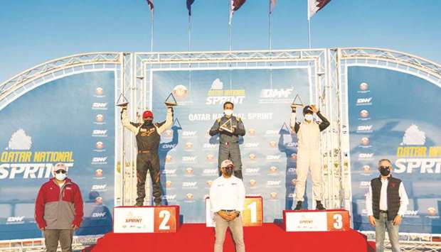 Open class 1 winner Abdullah al-Khelaifi (top centre) poses with runner-up Mansour Chebli (left), third-placed Abdul Aziz al-Jabri and QMMF officials in Losail.