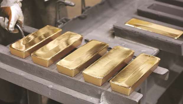 Freshly cast gold ingot bars sit in the foundry at the JSC Krastsvetmet non-ferrous metals plant in Krasnoyarsk, Russia. Gold posted the biggest annual advance in a decade after a tumultuous year, with gains in December aided by the dollaru2019s decline to the lowest since April 2018.