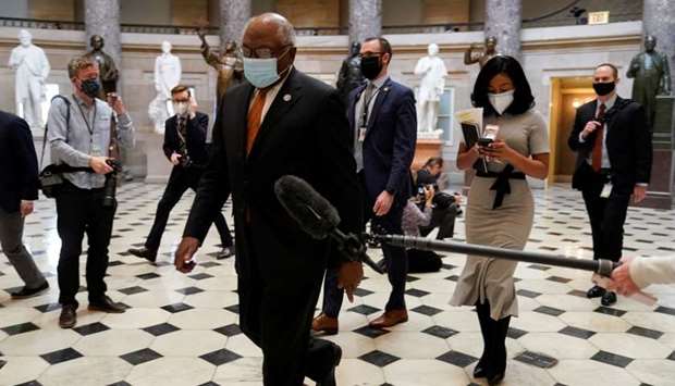 House Majority Whip James Clyburn walks to the House Chamber as Democrats debate one article of impeachment against US President Donald Trump at the US Capitol, in Washington