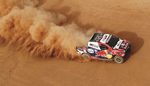 Qataru2019s Nasser al-Attiyah and co-Driver Matthieu Baumel of France in action during stage 10 of the Dakar Rally between Neom and Al Ula in Saudi Arabia yesterday. (Reuters)