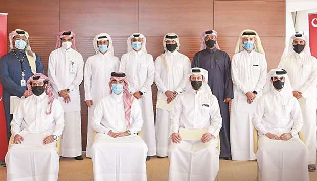 Vodafone CHRO Khames al-Naimi with Qatari employees who undertook the Telecoms MBA.