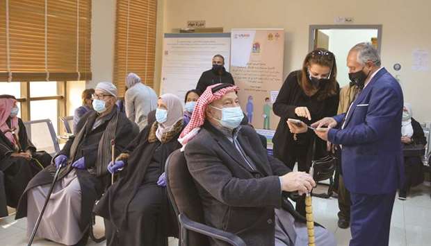 Jordanians wait to receive the Covid-19 vaccine, at a medical centre in Amman, yesterday.