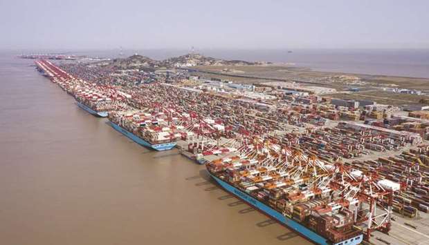 An aerial view of the Yangshan Deepwater Port in Shanghai. Chinau2019s exports rose 18.1% in December from a year earlier, slowing from a 21.1% jump in November but beating expectations for a 15% rise.