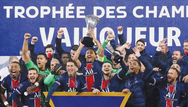 Paris Saint-Germain players celebrate winning the Trophee des Champions after beating Marseille at Stade Bollaert-Delelis in Lens, France, on Wednesday. (Reuters)