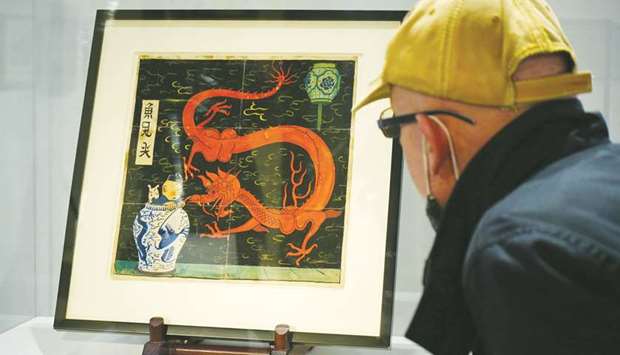 A painting for the original cover of The Blue Lotus (Lotus Bleu) Tintin comic book (1936), is displayed before being auctioned by Artcurial in Paris.